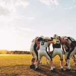 Client-Impact-Varisty-Brands-Football-Huddle-Photo